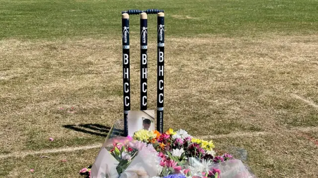 Flowers at cricket stumps