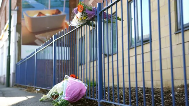 Flowers left outside a building on Ilkeston Road, Nottingham