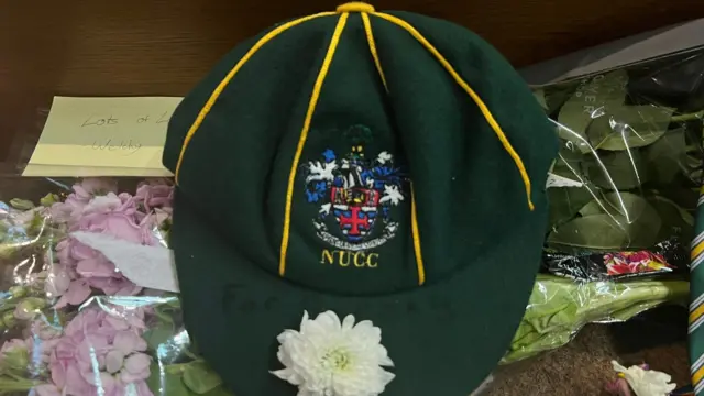 A University of Nottingham Cricket Club cap is left for Barnaby Webber