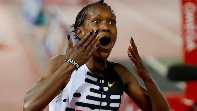 Kenya's Faith Kipyegon celebrates winning the women's 1500m final and setting a new world record