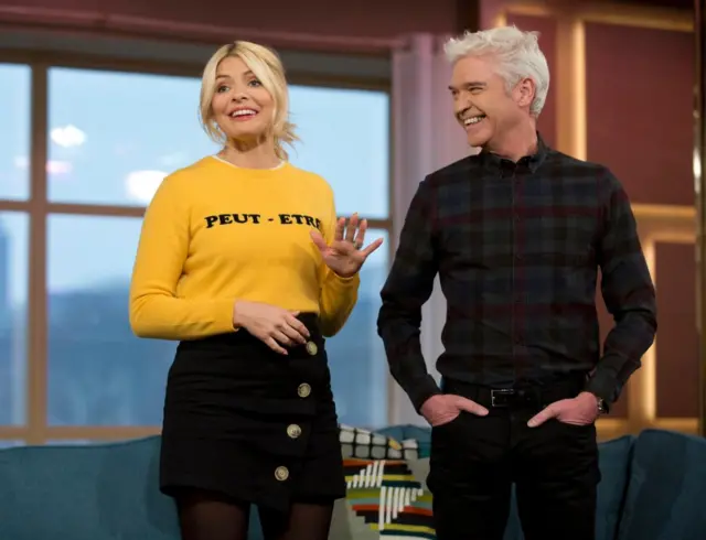 Holly Willoughby stands next to Phillip Schofield in This Morning Studio