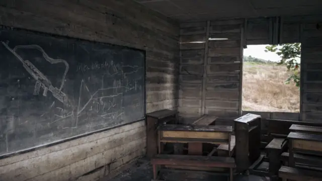 An AK-47 type rifle is drawn on the blackboard of a classroom used by M23 fighters as a military base in Kishishe, eastern Democratic Republic of Congo -  5 April 2023