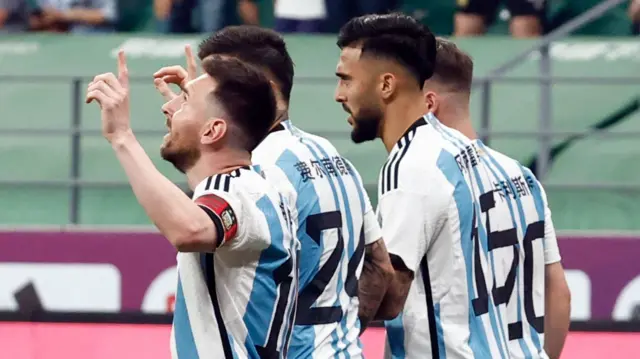 Lionel Messi looks to the sky in celebration after scoring for Argentina against Australia in Beijing