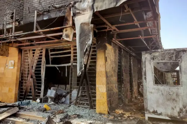 A burnt-down branch of a bank is pictured in southern Khartoum on May 24, 2023