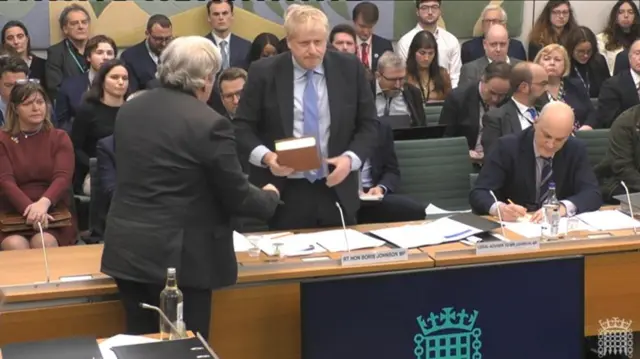 Johnson taking oath at Privileges Committee