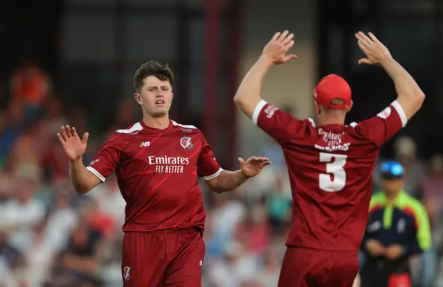 Jake Blatherwick celebrates taking the wicket of Saif Zaib