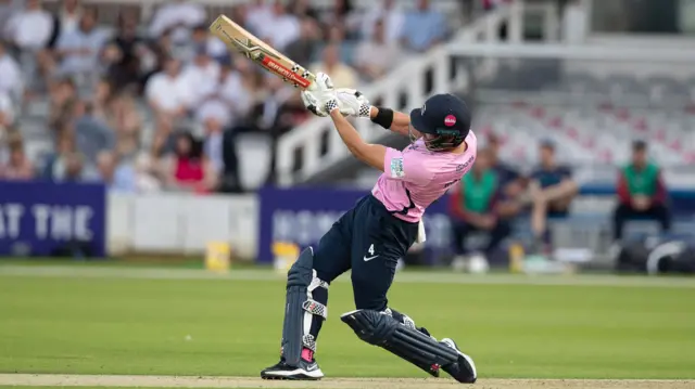 Middlesex's Max Holden hits out