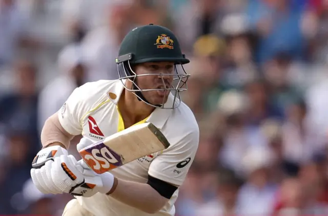 David Warner hitting a shot