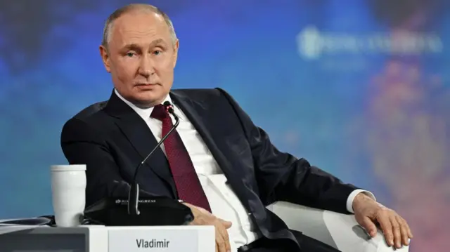 Putin speaks to an economic forum in St Petersburg, Russia