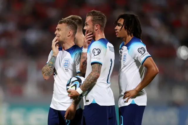 England players stand over a free-kick