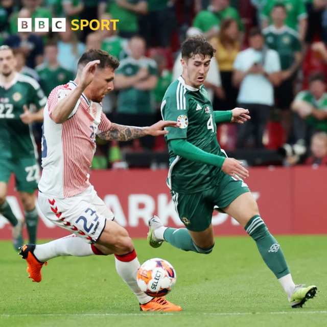 Denmark's Pierre-Emile Hejbjerg with Northern Ireland's Trai Hume.