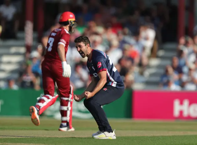 Ben Sanderson celebrates the wicket of Jos Buttler