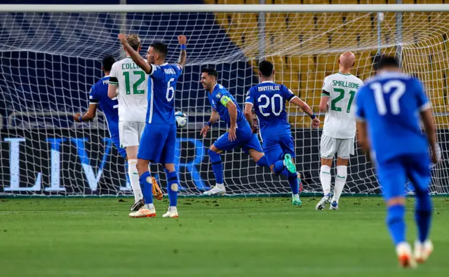 Greece celebrate their goal