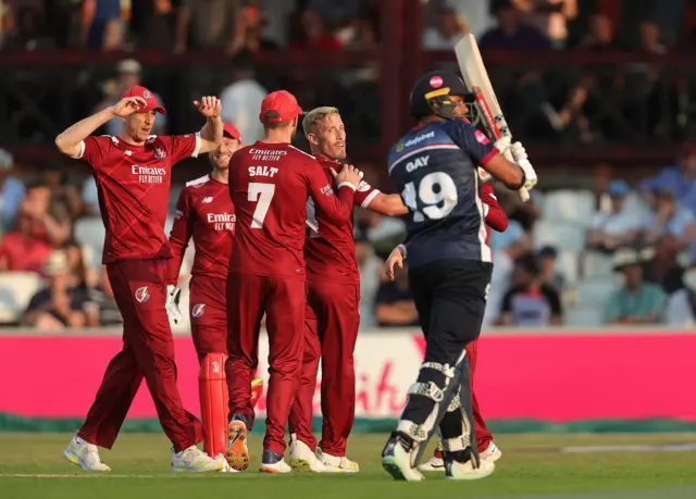 Lancashire celebrate the wicket of Emilio Gay