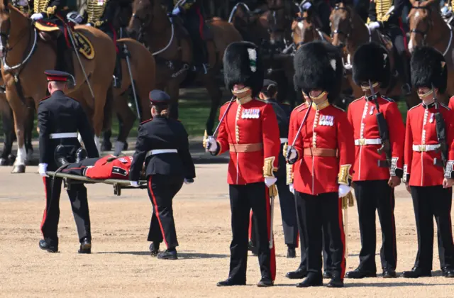 Soldier being carried off on a stretcher