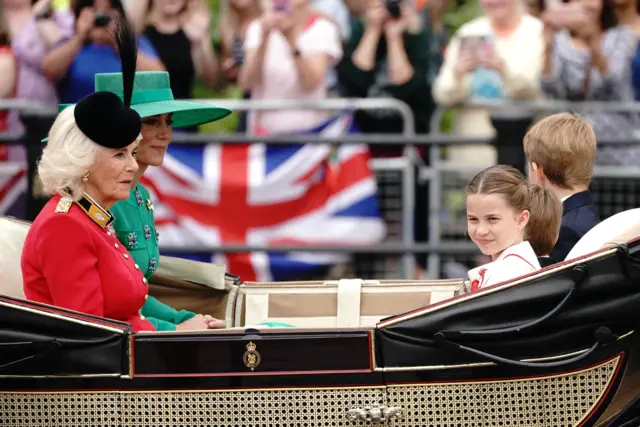 Queen Camilla, Catherine, the Princess of Wales, and her children, Charlotte, Louis and George were pictured in a carriage