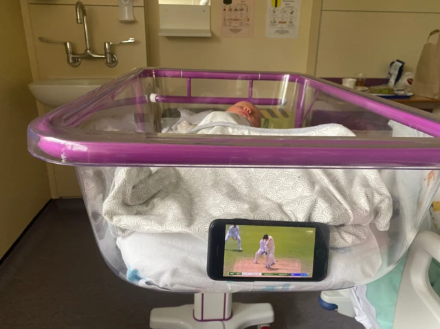 James' photo of his new baby and the cricket on his phone