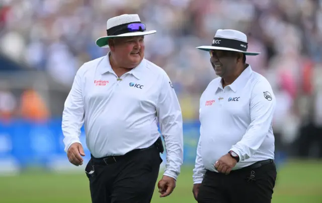 Umpires Marais Erasmus and Ashan Raza