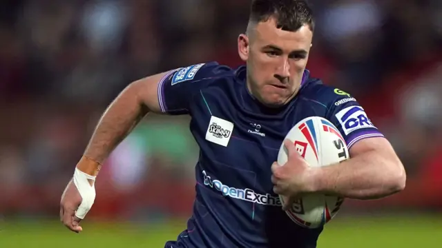 Wigan's Harry Smith carries the ball