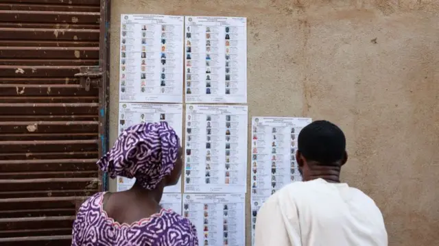 Voters check for their names on voting lists ahead of Mali's referendum vote in Bamako on June 18, 2023