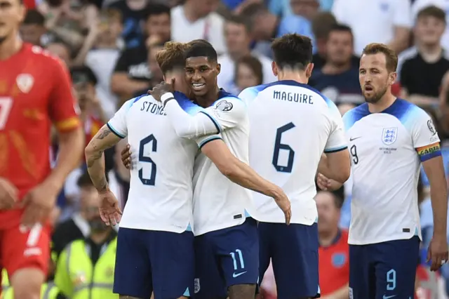 Marcus Rashford celebrates with John Stones after scoring in England's Euro 2024 qualifier against North Macedonia at Old Trafford