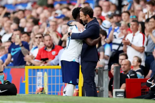 Bukayo Saka embraces Gareth Southgate during England's Euro 2024 qualifier against North Macedonia