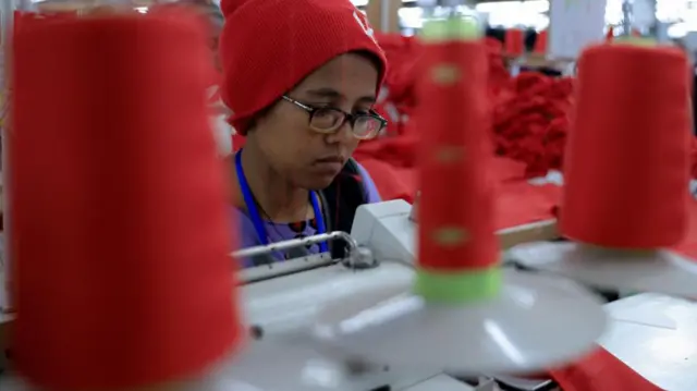 An employee works at the Shin Textile Solutions factory during the launch of the Developing Countries Trading Scheme (DCTS) to support sustainable growth in developing countries in the Bole Lemi Industrial Park in Addis Ababa, Ethiopia, June 19, 2023