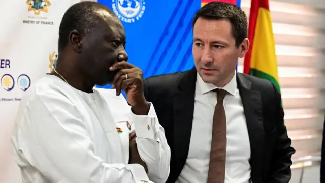 en Ofori-Atta, Ghana's finance minister, speaks with Stephane Roudet, IMF Mission Chief for Ghana, during a news conference in Accra, Ghana December 13, 2022