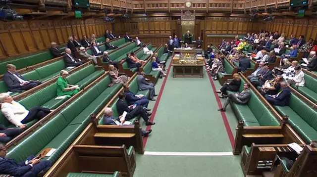 Wide shot of the Commons showing fewer than 70 MPs