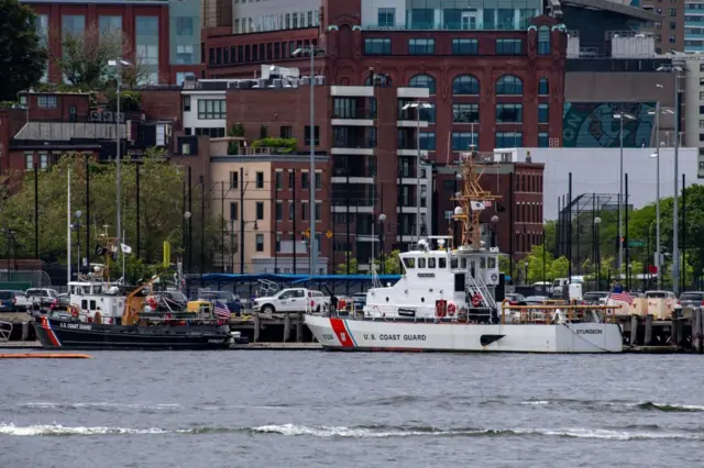 Two US Coast Guard vessels sit in port in Boston Harbour across from the US Coast Guard Station Boston in Boston, Massachusetts, on June 19, 2023. A submersible vessel used to take tourists to see the wreckage of the Titanic in the North Atlantic has gone missing, triggering a search-and-rescue operation, the US Coast Guard said on June 19, 2023. It was not immediately known how many people are on the vessel, operated by a company called OceanGate Expeditions. "Yes, we're searching for it," said an official from the US Coast Guard Rescue Coordination Centre in Boston.