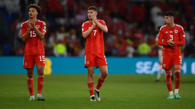 Wales players dejected after losing to Armenia