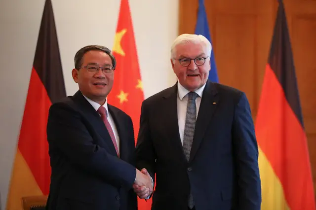 German President Frank Walter Steinmeier shakes hands with Chinese Premier Li Qiang