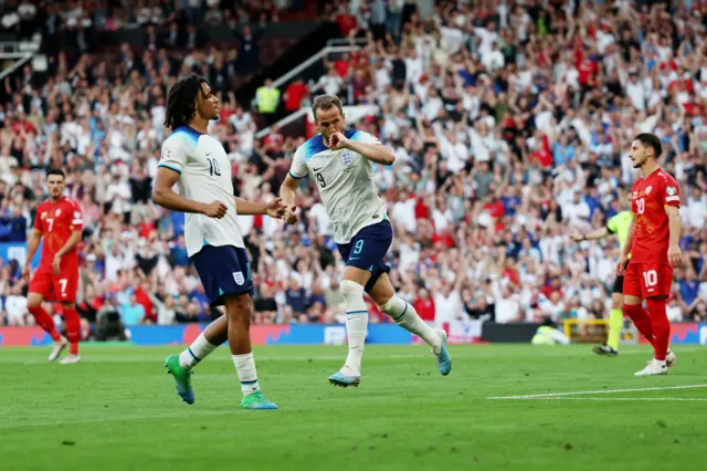 Harry Kane celebrates scoring for England in their Euro 2024 qualifier against North Macedonia at Old Trafford