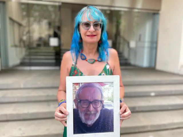 Sioux Vosper holds a photo of her father