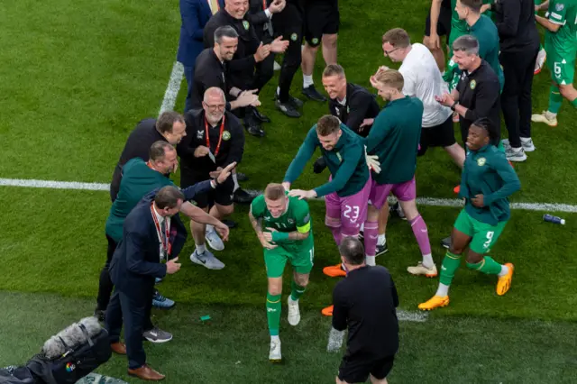 Players and staff celebrate James McClean reaching 100 caps