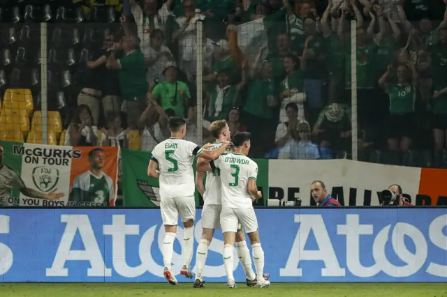 Nathan Collins celebrates his equaliser against Greece with the travelling Republic fans