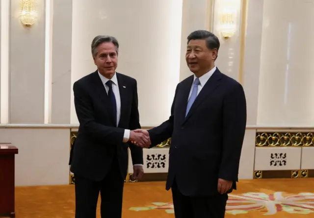 US Secretary of State Antony Blinken shakes hands with China's President Xi Jinping