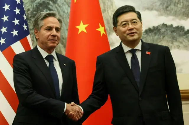 US Secretary of State Antony Blinken (L) and China's Foreign Minister Qin Gang shake hands