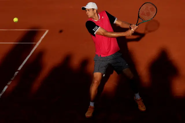 Hubert Hurkacz hits a backhand shot