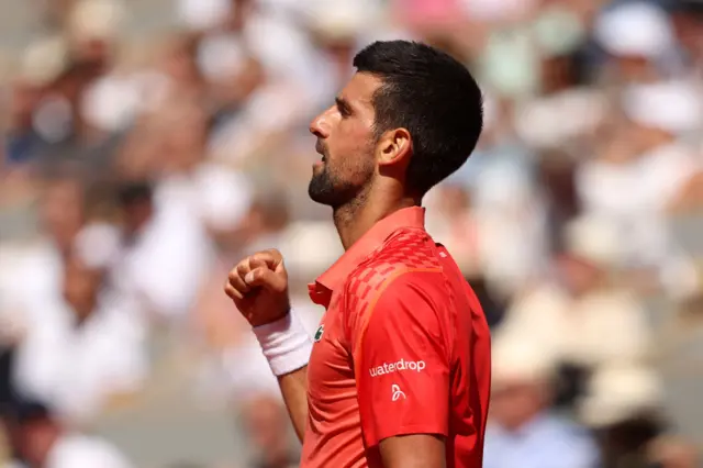 Novak Djokovic pumps his fist in celebration