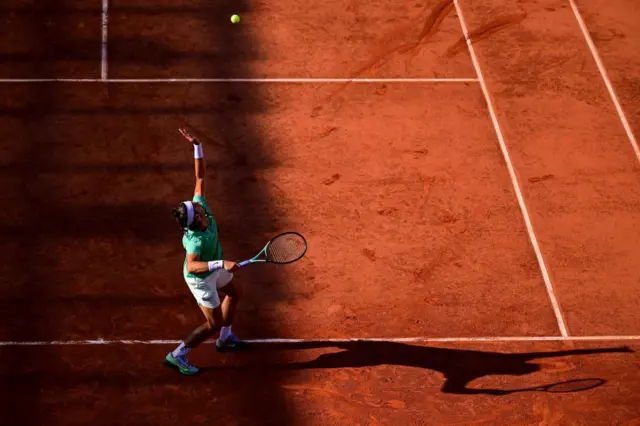 Lorenzo Musetti serves