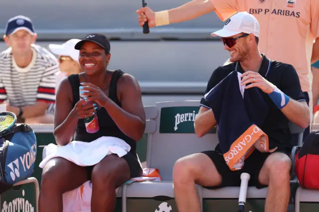 Taylor Townsend and Jamie Murray laugh on the bench