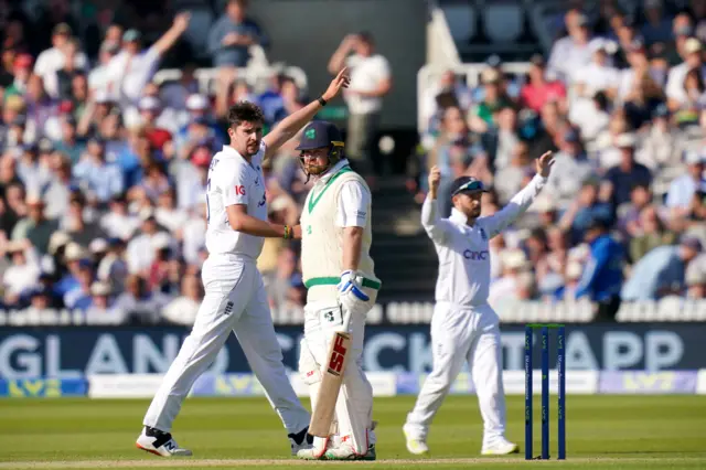 Josh Tongue celebrates the wicket of Paul Stirling