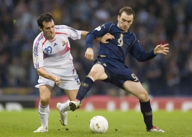 Willy Sagnol battles with James McFadden at Hampden