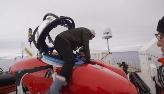 Claire Marshall getting in to the submarine