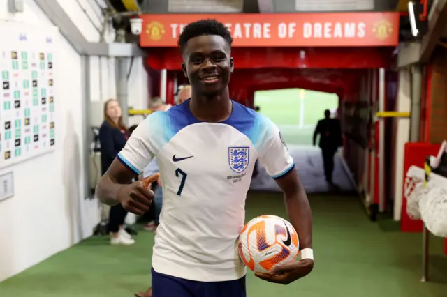 England's Bukayo Saka holding a match ball