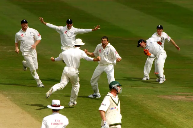 England's Steve Harmison (C) celebrates with team-mates after taking the last wicket of Australia's Michael Kasprowicz caught behind by wicketkeeper Geraint Jones (R) during the fourth day.