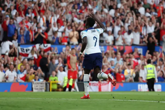 Bukayo Saka celebrates scoring a hat-trick for England at Old Trafford