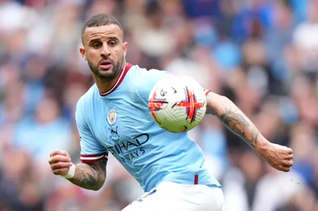 Manchester City's Kyle Walker looking at a football