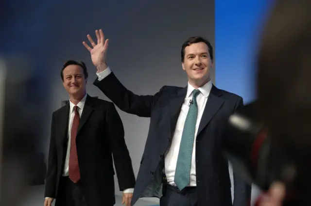 David Cameron and George Osborne smile and wave to a crowd